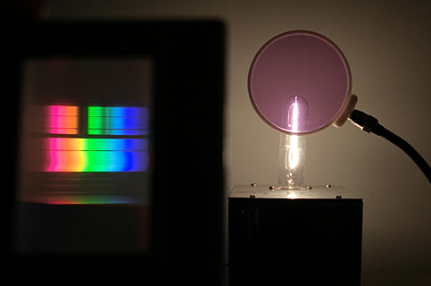 light bulb viewed through diffraction grating and filter