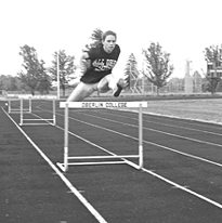 Image of Oberlin athlete jumping a hurdle