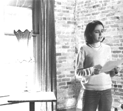 Photo of student reading poetry at the Feve