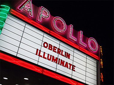 Apollo movie theater marquee, reading Oberlin Illuminate.