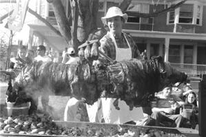Photo of students at Tank Co-op roasting a pig