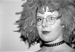 Photo of student wearing feather wig