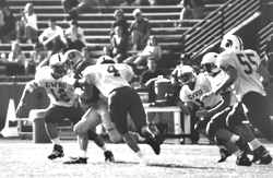 Photo of the football team playing against Case Western