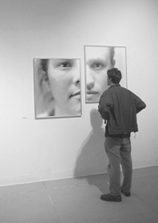 Photo of student admiring student photography