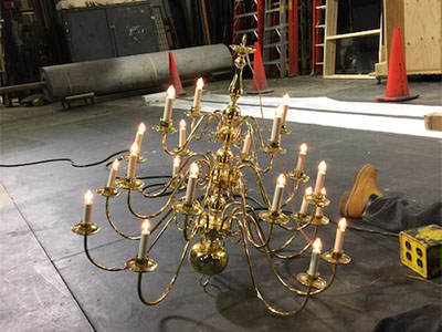 Photo of chandelier resting on a stage