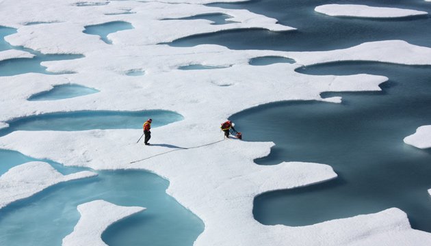 Ponds form atop Arctic sea ice as it melts